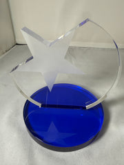 Clear plastic visor with a blue circular component on a gray background