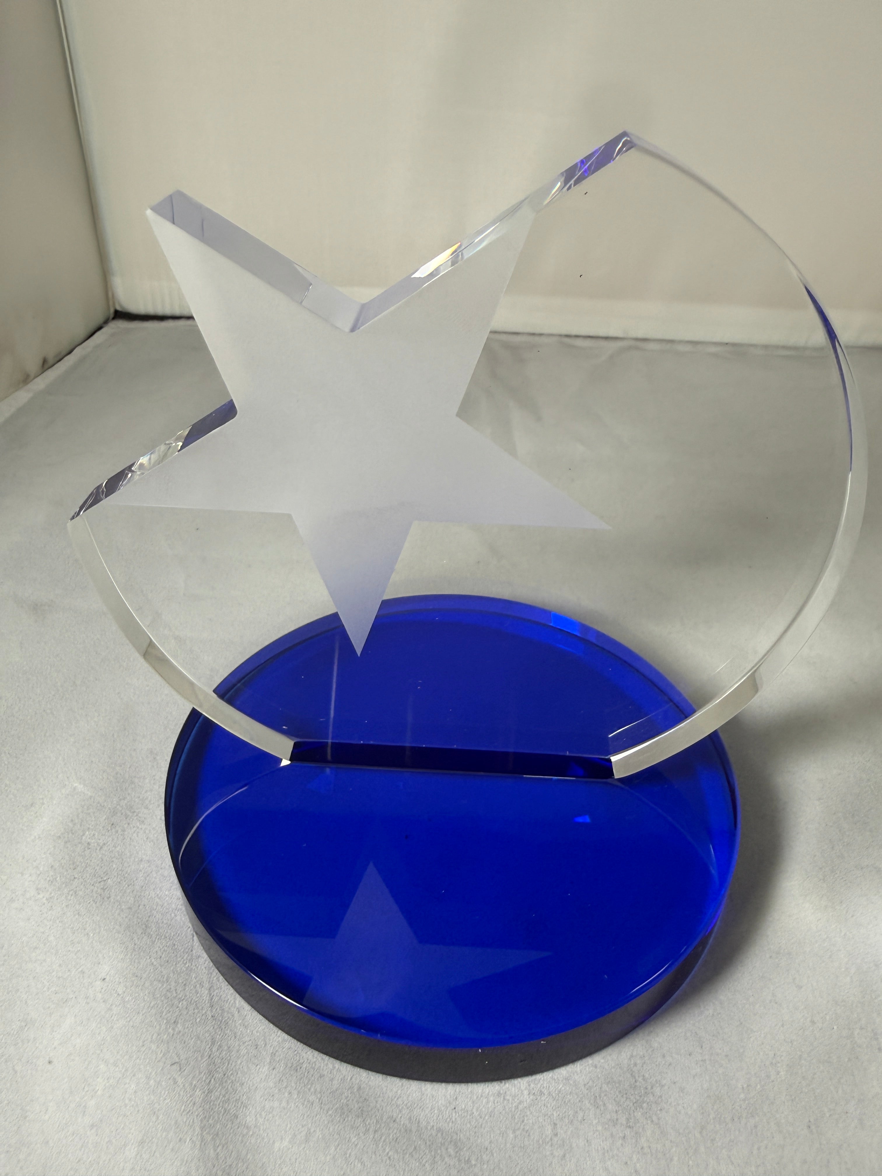 Clear plastic visor with a blue circular component on a gray background