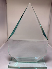 Clear glass pyramid-shaped award on a white background