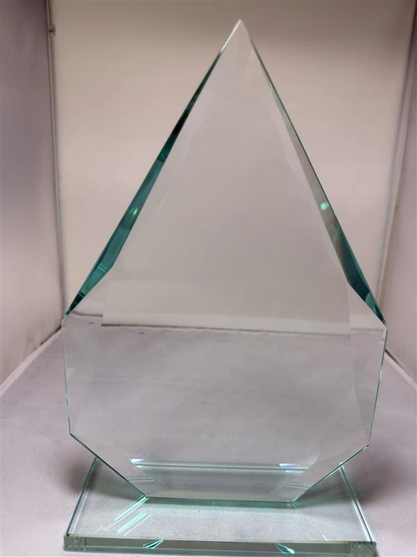 Clear glass pyramid-shaped award on a white background
