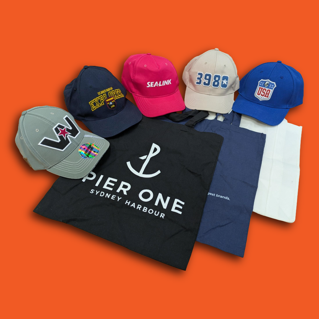 Collection of hats and t-shirts on an orange background